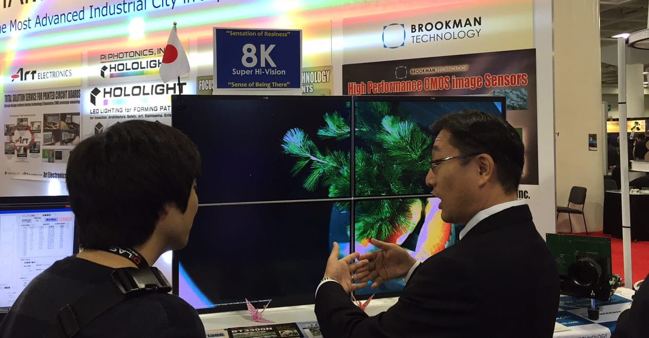 man shows off 8k at SPIE